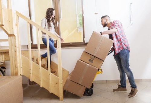 Residential moving boxes organized by room in Bankside